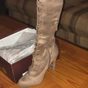 Laced up thigh-high heeled boots